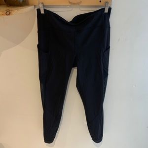 Black Lululemon workout leggings with mesh insert